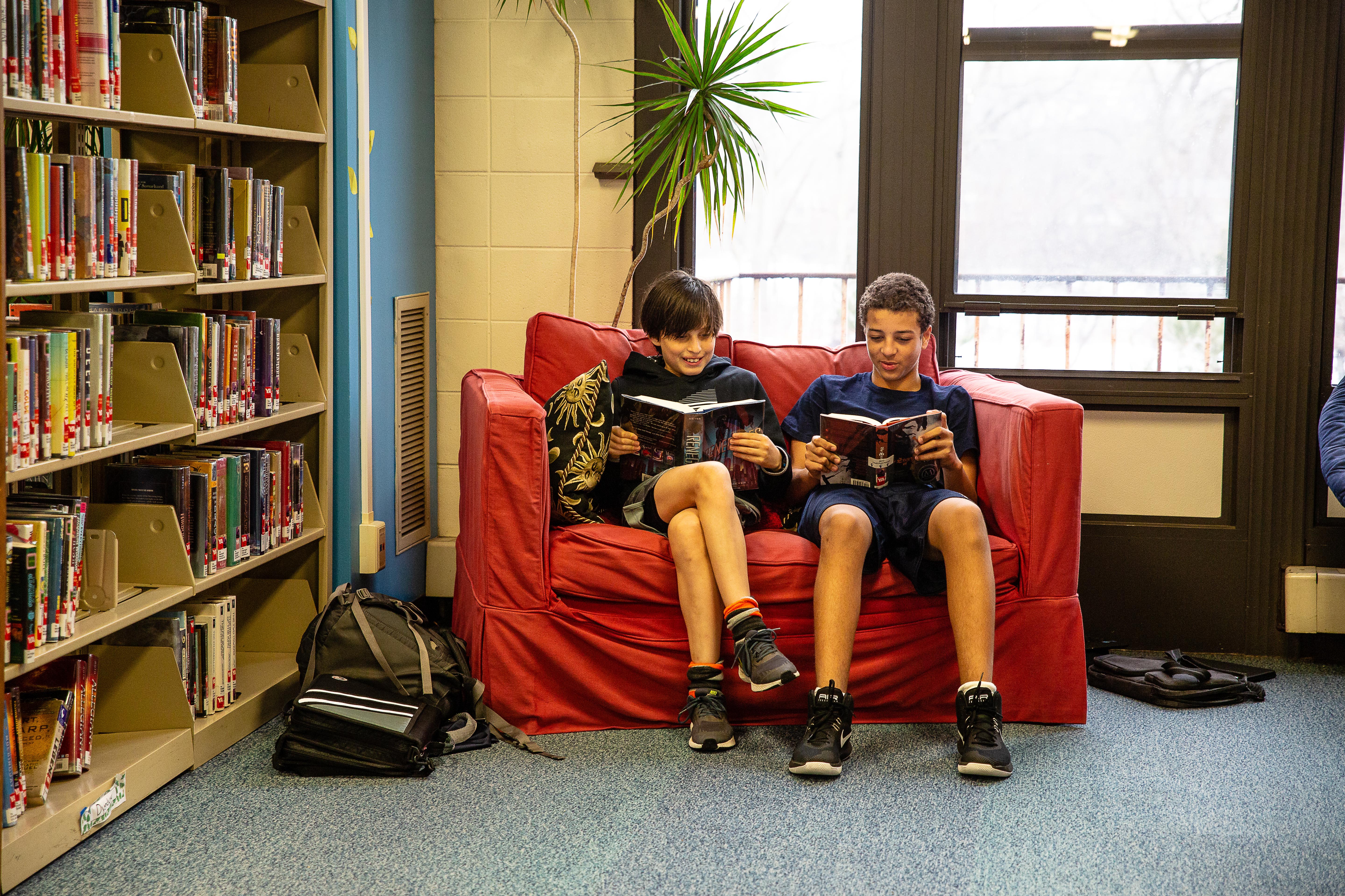 Middle School students reading at the Baker Library