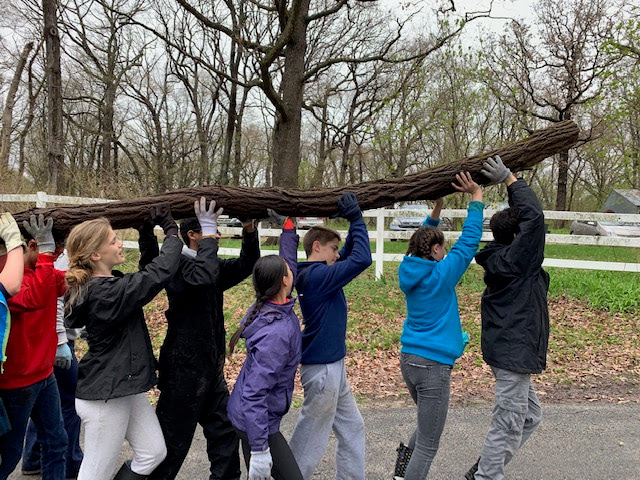 Middle School students engaged in team work and experiential learning