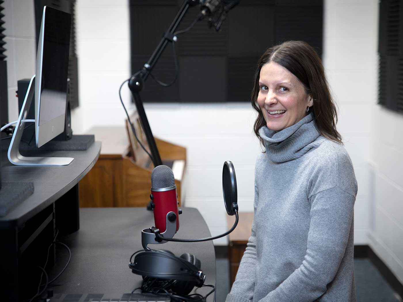 The digital storytelling suite consists of a podcasting/audio lab and a green room that students use to create and learn