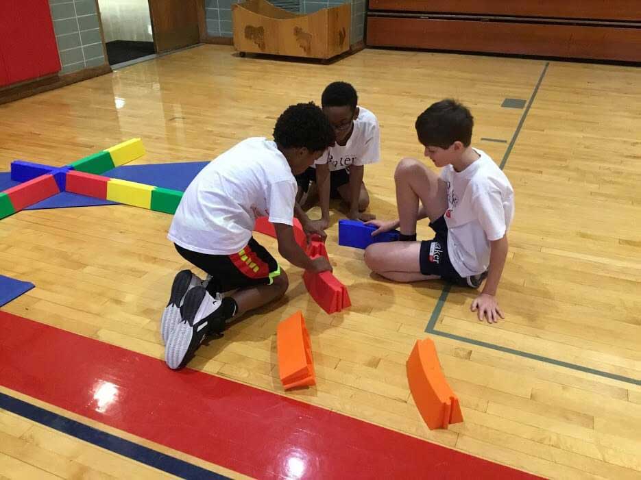 apart but connected Students work together in 7th Grade PE